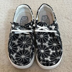 Hey Dude Womens Black and White Floral Sneakers